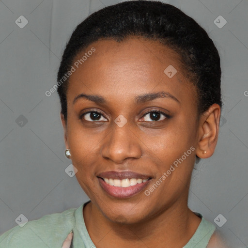 Joyful black young-adult female with short  brown hair and brown eyes