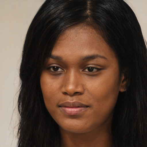 Joyful asian young-adult female with long  black hair and brown eyes