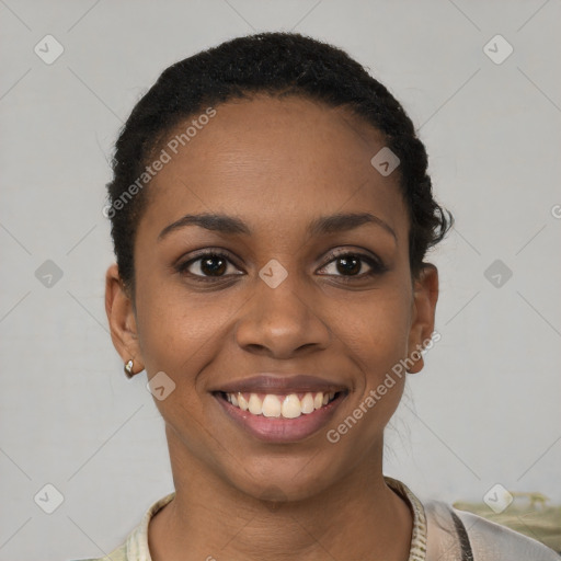 Joyful black young-adult female with short  black hair and brown eyes