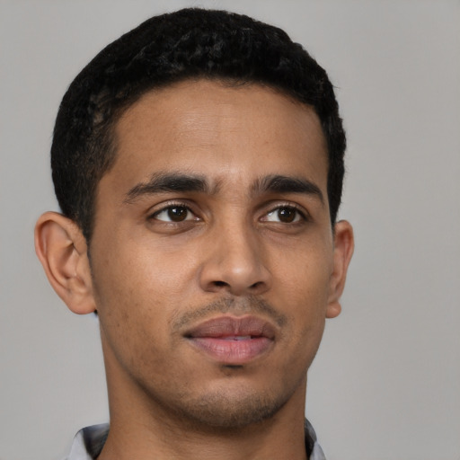 Neutral latino young-adult male with short  brown hair and brown eyes