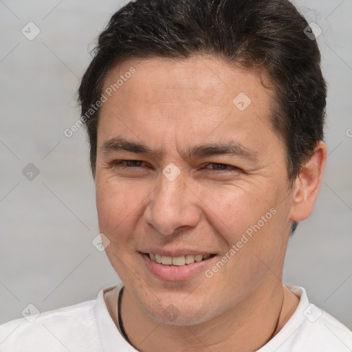 Joyful white adult male with short  brown hair and brown eyes