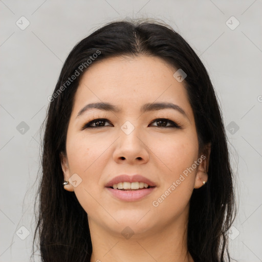 Joyful asian young-adult female with long  brown hair and brown eyes