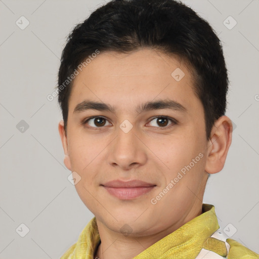 Joyful latino young-adult male with short  brown hair and brown eyes