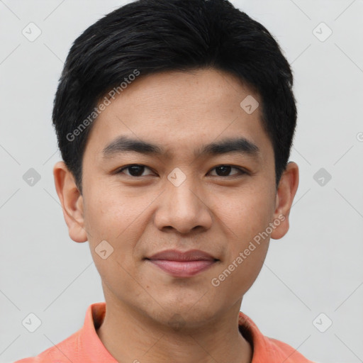 Joyful asian young-adult male with short  black hair and brown eyes