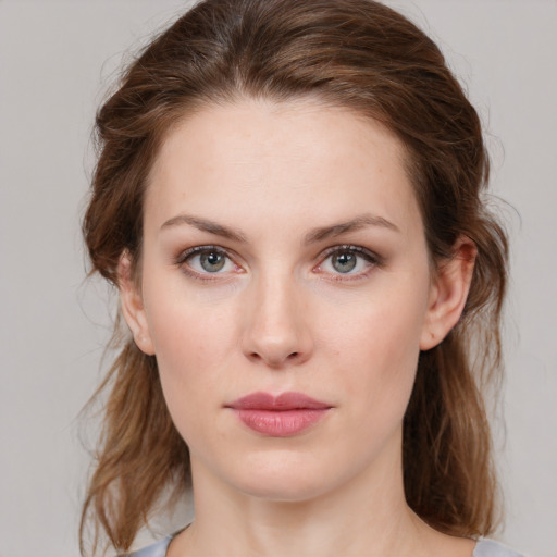 Neutral white young-adult female with medium  brown hair and green eyes