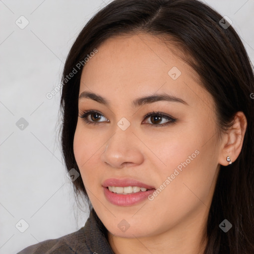 Joyful asian young-adult female with long  brown hair and brown eyes