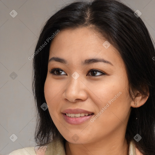 Joyful asian young-adult female with long  brown hair and brown eyes