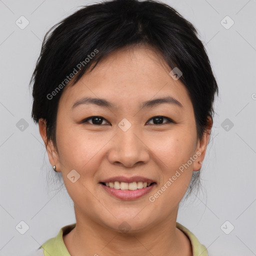 Joyful asian young-adult female with short  brown hair and brown eyes