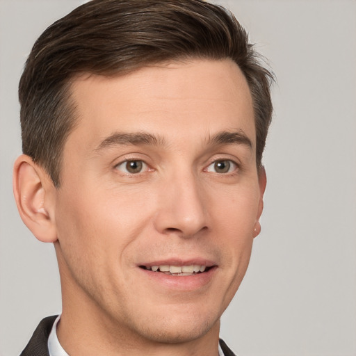 Joyful white young-adult male with short  brown hair and grey eyes