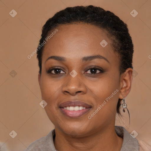 Joyful black young-adult female with short  brown hair and brown eyes