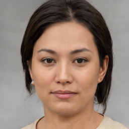 Joyful asian young-adult female with medium  brown hair and brown eyes