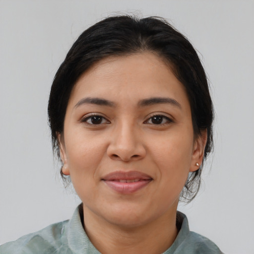 Joyful asian young-adult female with medium  brown hair and brown eyes