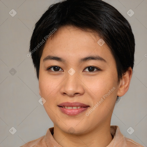 Joyful asian young-adult female with short  brown hair and brown eyes