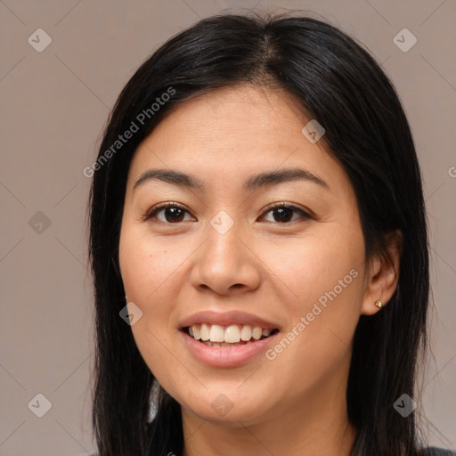 Joyful asian young-adult female with long  brown hair and brown eyes