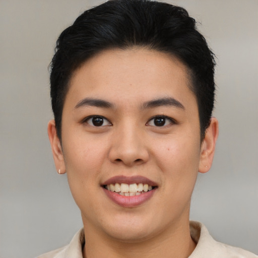 Joyful asian young-adult female with short  black hair and brown eyes