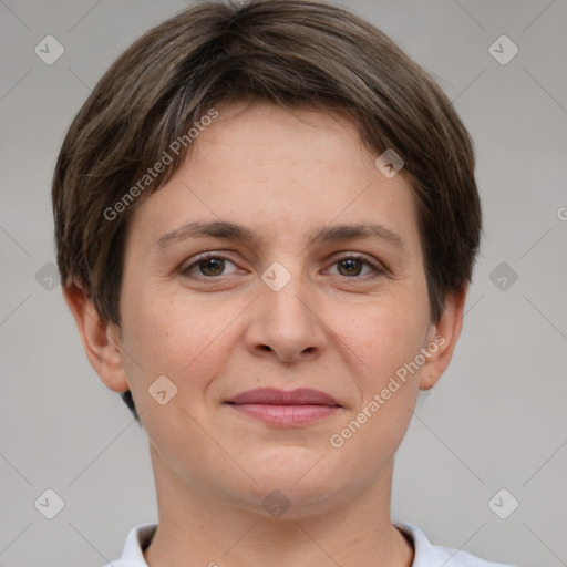 Joyful white young-adult female with short  brown hair and grey eyes