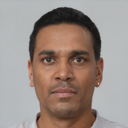 Neutral black young-adult male with short  black hair and brown eyes