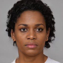 Neutral black young-adult female with short  brown hair and brown eyes