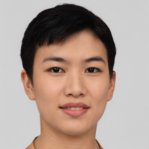 Joyful asian young-adult female with short  black hair and brown eyes