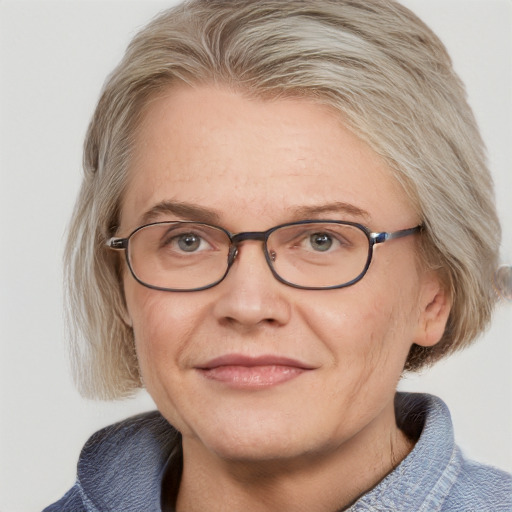 Joyful white adult female with medium  brown hair and blue eyes