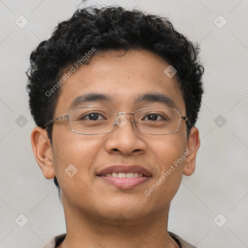 Joyful latino young-adult male with short  brown hair and brown eyes