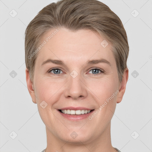 Joyful white adult female with short  brown hair and grey eyes