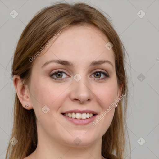 Joyful white young-adult female with long  brown hair and blue eyes