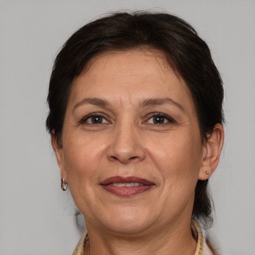 Joyful white adult female with medium  brown hair and brown eyes