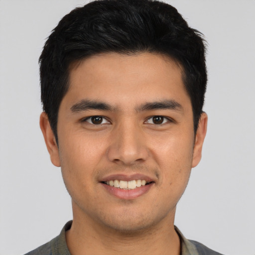 Joyful asian young-adult male with short  black hair and brown eyes