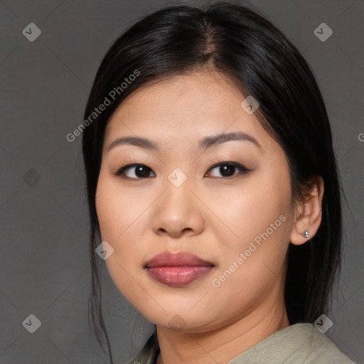 Joyful asian young-adult female with medium  black hair and brown eyes