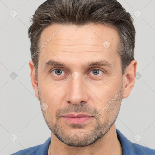 Neutral white adult male with short  brown hair and brown eyes