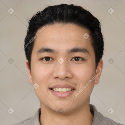 Joyful asian young-adult male with short  black hair and brown eyes