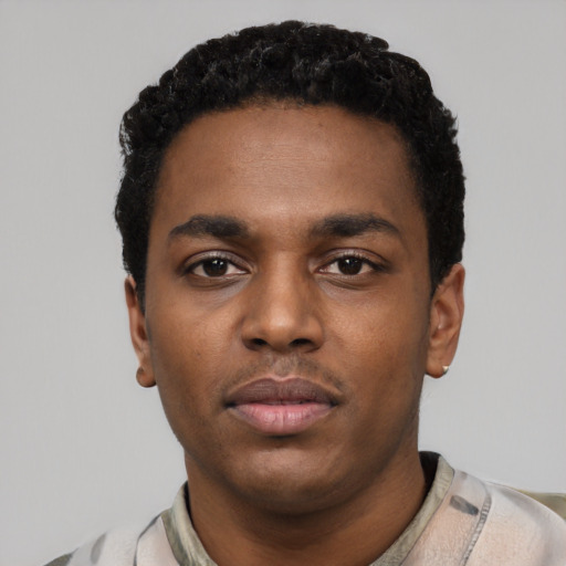Neutral black young-adult male with short  black hair and brown eyes