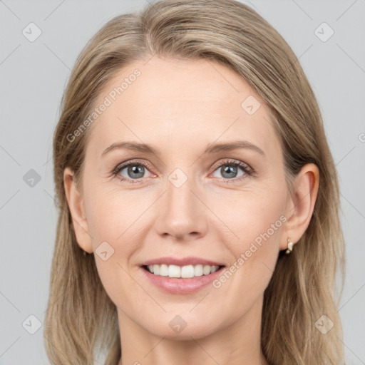 Joyful white young-adult female with medium  brown hair and blue eyes