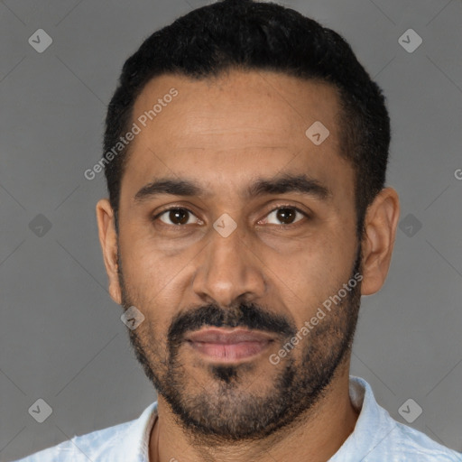 Joyful latino young-adult male with short  black hair and brown eyes