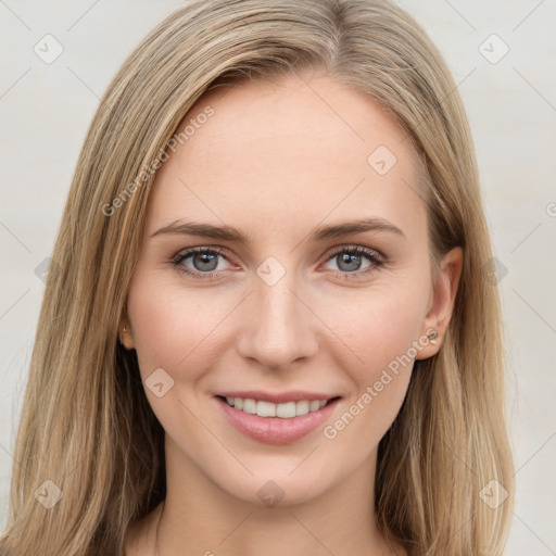 Joyful white young-adult female with long  brown hair and green eyes