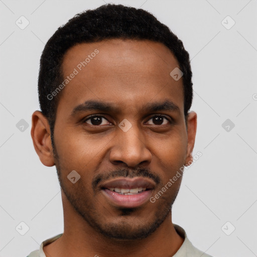 Joyful black young-adult male with short  brown hair and brown eyes