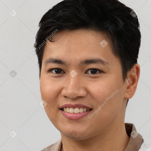 Joyful asian young-adult male with short  brown hair and brown eyes