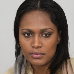 Neutral black young-adult female with long  brown hair and brown eyes