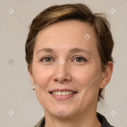 Joyful white adult female with short  brown hair and grey eyes