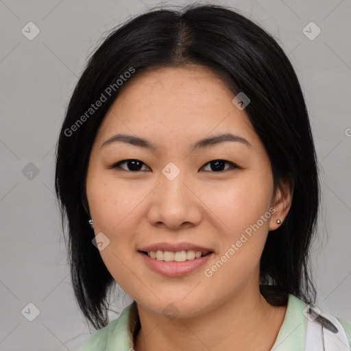 Joyful asian young-adult female with medium  black hair and brown eyes