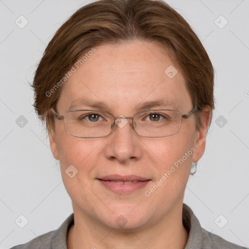 Joyful white adult female with short  brown hair and grey eyes