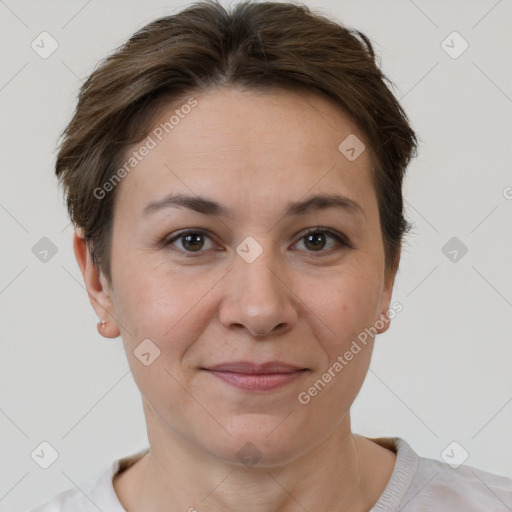 Joyful white adult female with short  brown hair and brown eyes