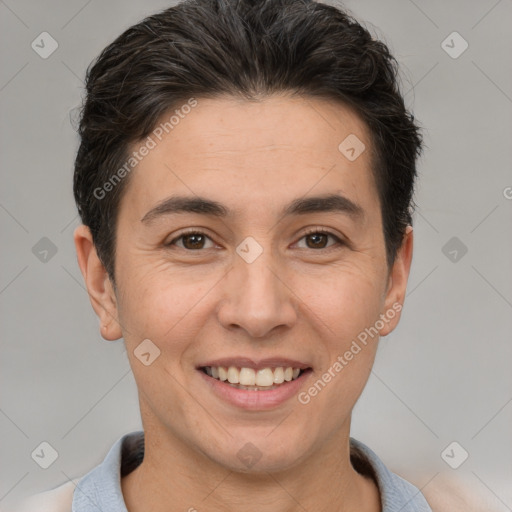 Joyful white adult male with short  brown hair and brown eyes