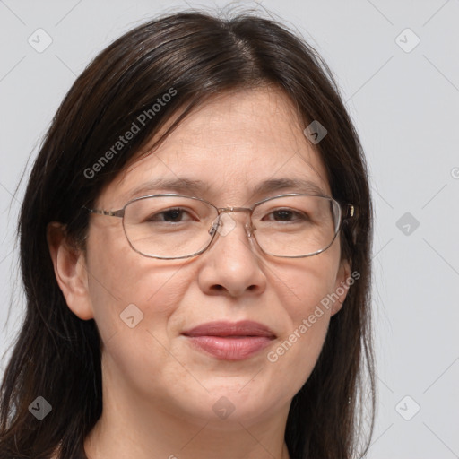 Joyful white adult female with long  brown hair and brown eyes