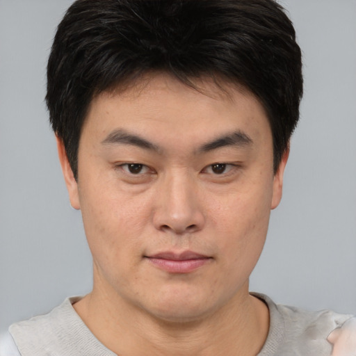Neutral asian young-adult male with short  brown hair and brown eyes