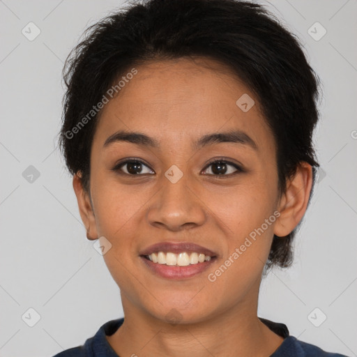 Joyful latino young-adult female with short  brown hair and brown eyes