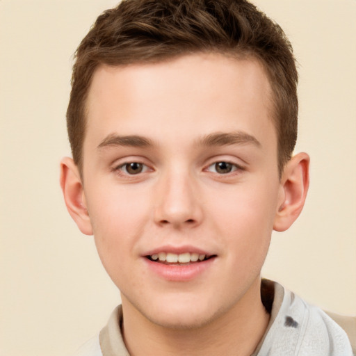 Joyful white child male with short  brown hair and brown eyes