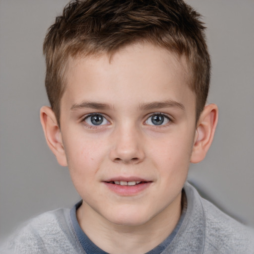 Joyful white child male with short  brown hair and blue eyes