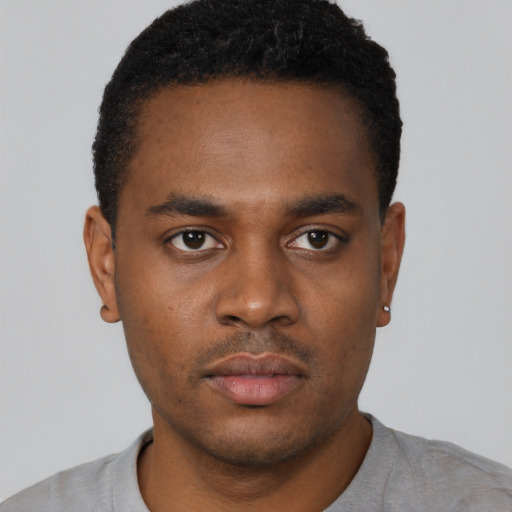 Neutral black young-adult male with short  black hair and brown eyes